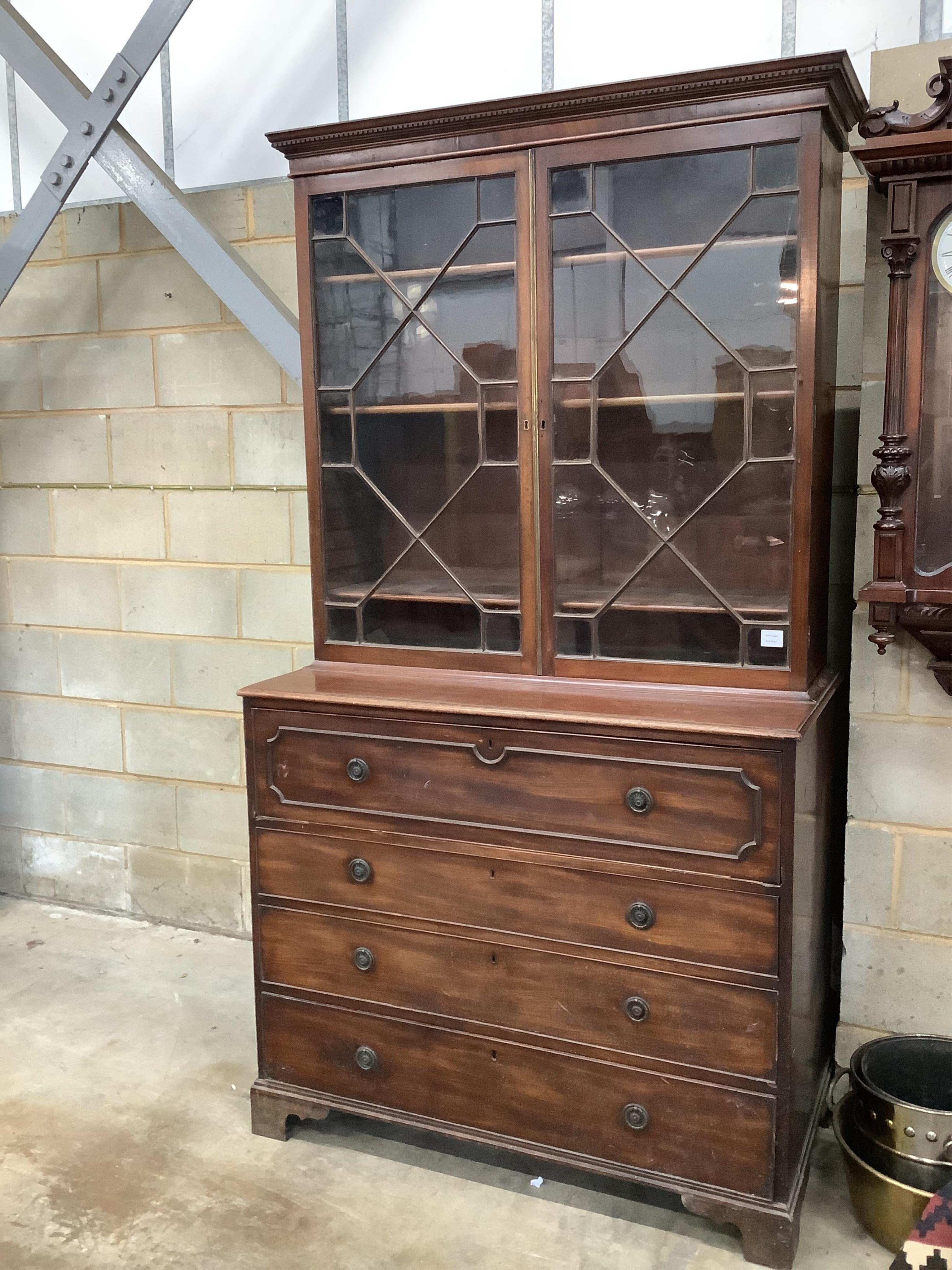 A Regency mahogany secretaire bookcase, width 116cm, depth 58cm, height 217cm. Condition - fair, two glass panes cracked